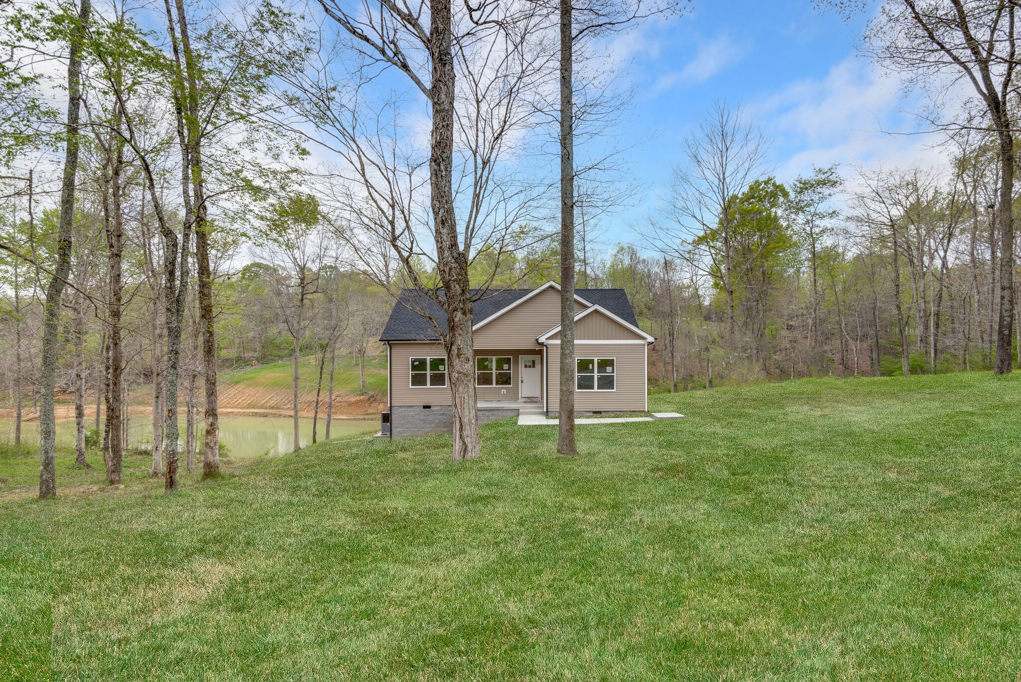 1170 Cowan Road Dickson, TN 37055 - Photo 3 of 30 a view of a house with a big yard and large trees