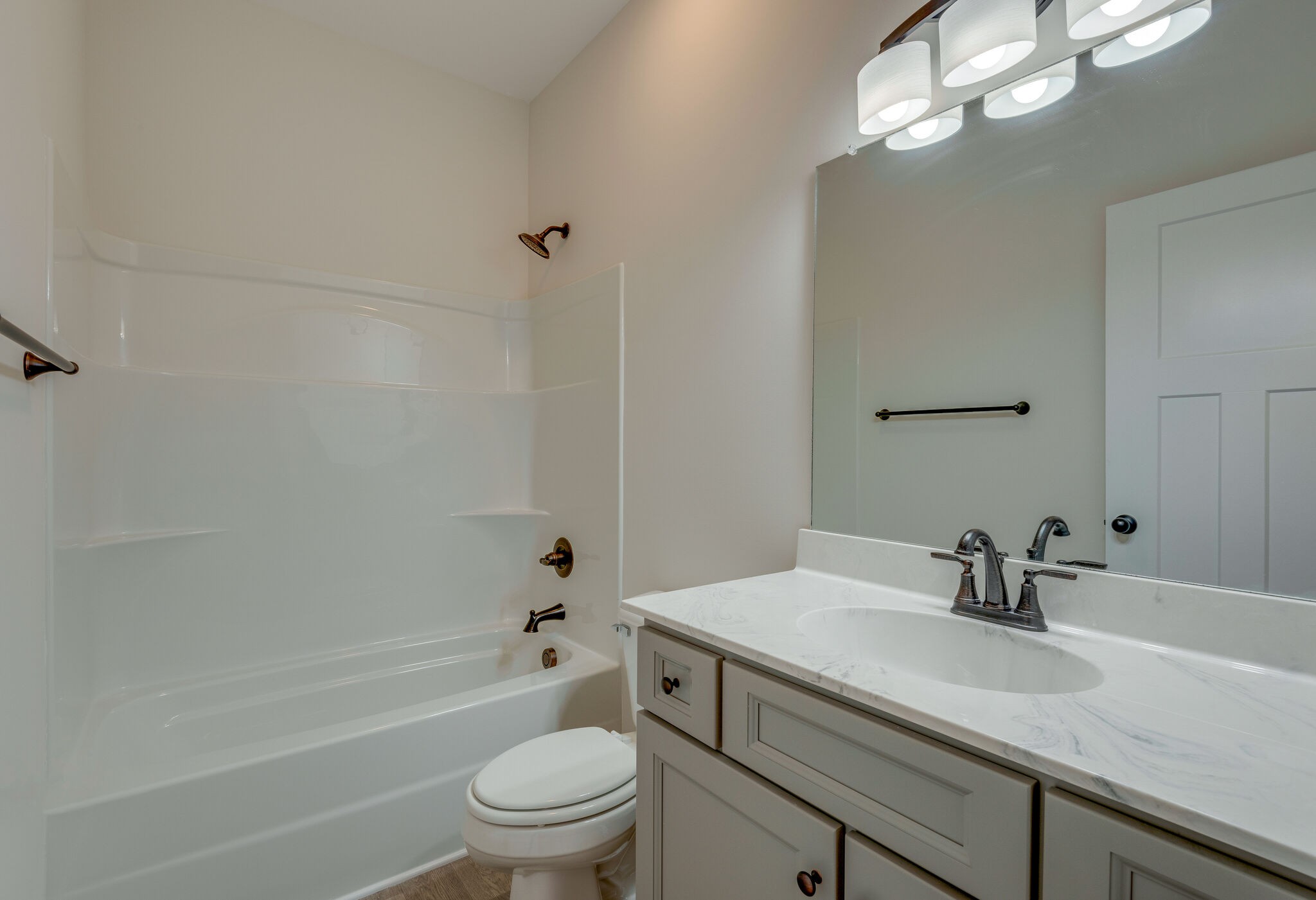 1170 Cowan Road Dickson, TN 37055 - Photo 21 of 30 a bathroom with a sink a toilet and shower