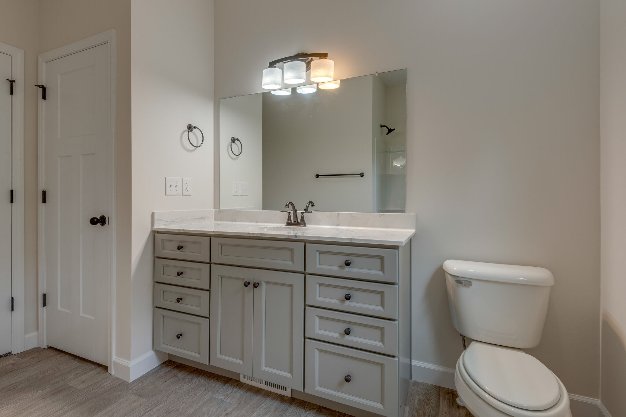 1170 Cowan Road Dickson, TN 37055 - Photo 22 of 30 a bathroom with a toilet a sink and mirror