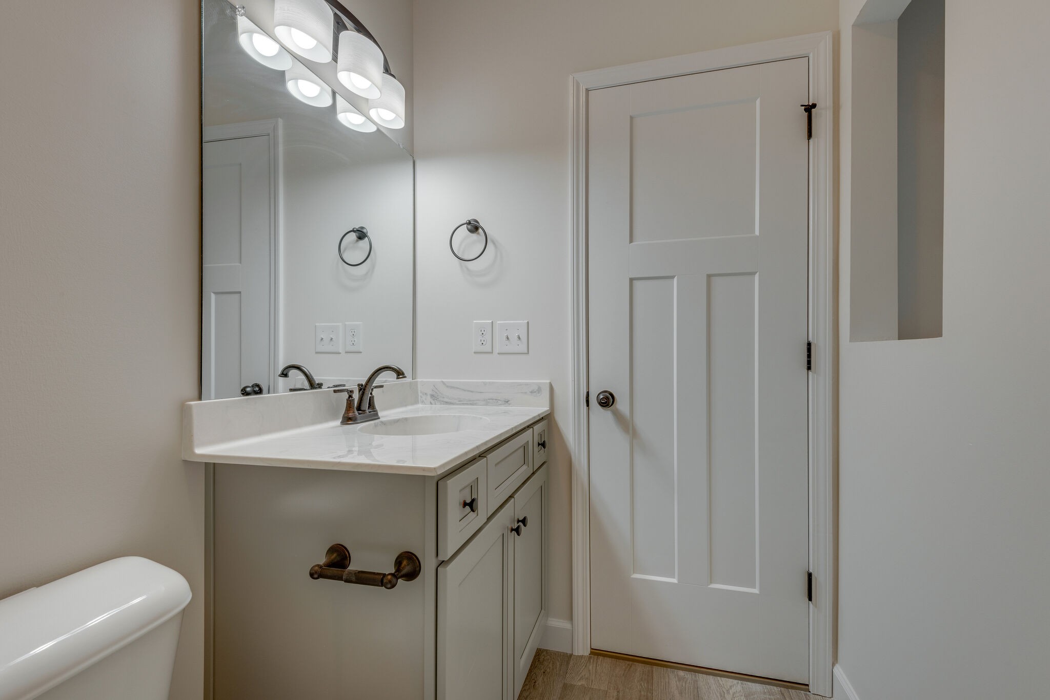 1170 Cowan Road Dickson, TN 37055 - Photo 23 of 30 a bathroom with a granite countertop sink a toilet and a mirror