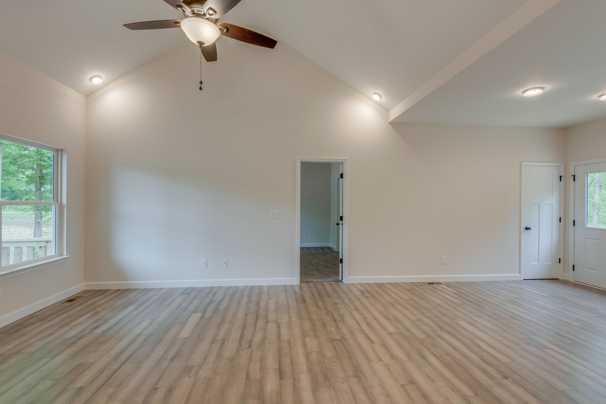 1170 Cowan Road Dickson, TN 37055 - Photo 7 of 30 an empty room with wooden floor and windows