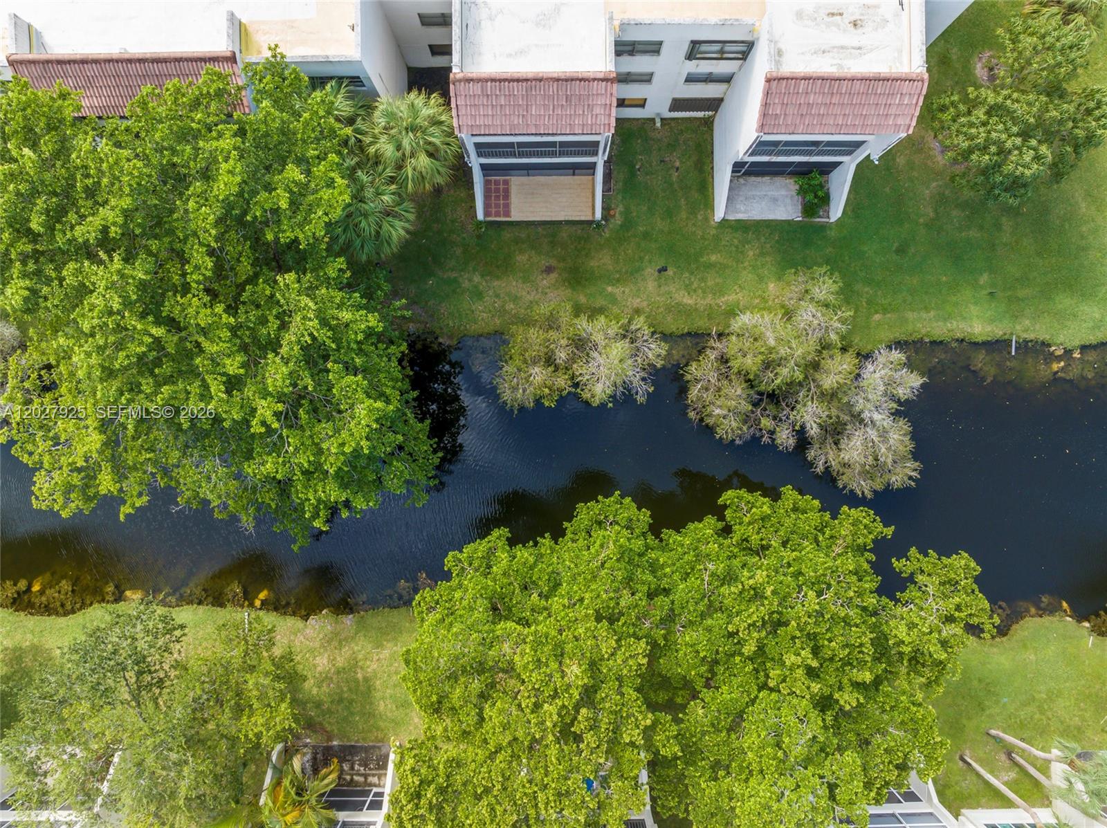 301 Racquet Club Road, Unit 103 Weston, FL 33326 - Photo 19 of 20 an aerial view of residential house with yard and lake view