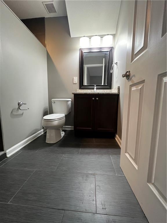 1105 Riverside Drive, Unit 1 Beaver, PA 15009 - Photo 15 of 20 a bathroom with a toilet a sink and mirror