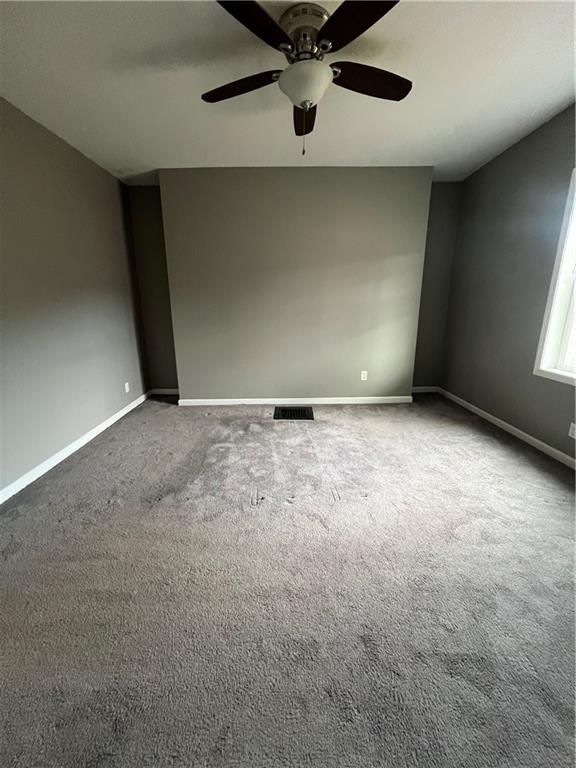 1105 Riverside Drive, Unit 1 Beaver, PA 15009 - Photo 19 of 20 an empty room with a ceiling fan and window