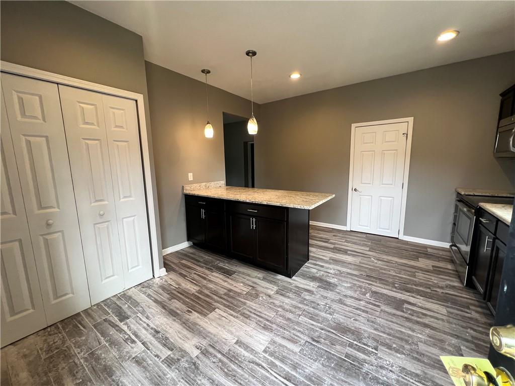 1105 Riverside Drive, Unit 1 Beaver, PA 15009 - Photo 5 of 20 a view of kitchen and empty room with wooden floor