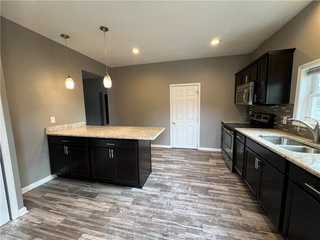 1105 Riverside Drive, Unit 1 Beaver, PA 15009 - Photo 6 of 20 a spacious bathroom with a sink and a mirror