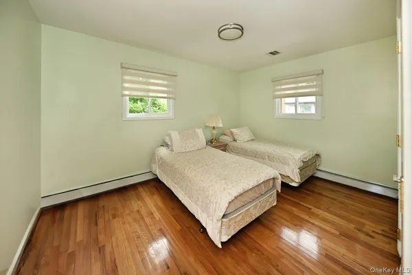 a bathroom with a sink toilet vanity and shower