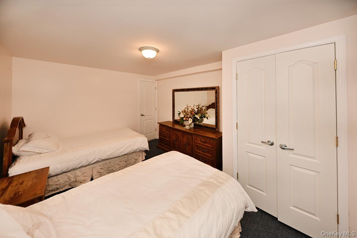 2 Elener Lane Spring Valley, NY 10977 - Photo 15 of 30 a bedroom with double bed and a closet