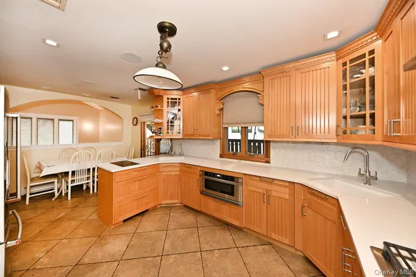 a kitchen with stainless steel appliances granite countertop a sink and cabinets