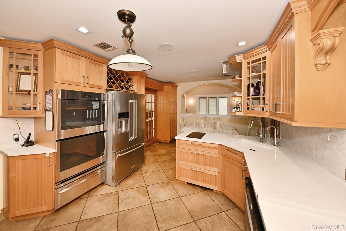 2 Elener Lane Spring Valley, NY 10977 - Photo 6 of 30 a kitchen with stainless steel appliances granite countertop a sink and cabinets