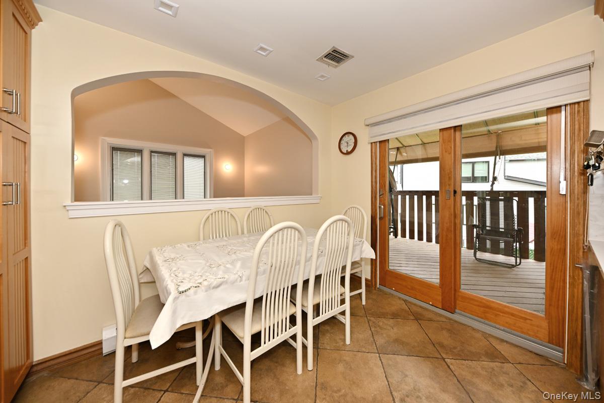 2 Elener Lane Spring Valley, NY 10977 - Photo 7 of 30 a dining room with furniture and a floor to ceiling window