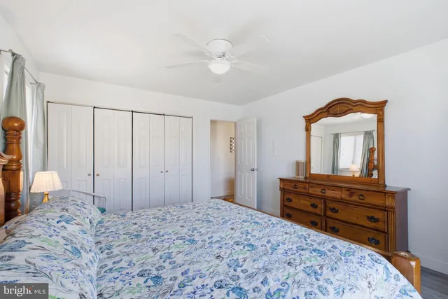 a bedroom with a bed and a dresser