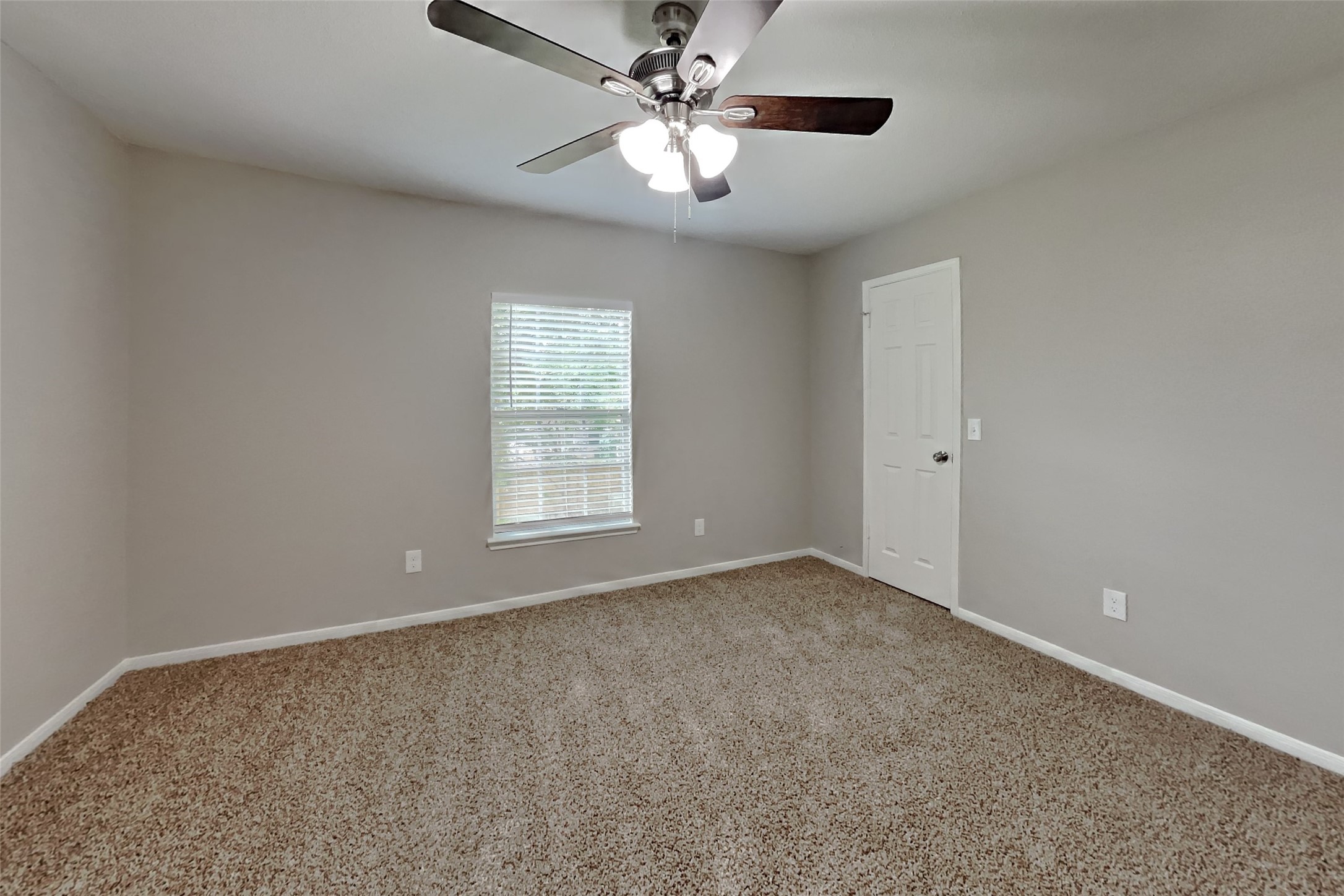 16303 Hickory Point Road Houston, TX 77095 - Photo 13 of 21 an empty room with windows and fan
