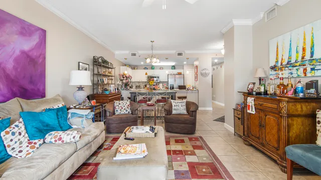 a living room with furniture and a dining table