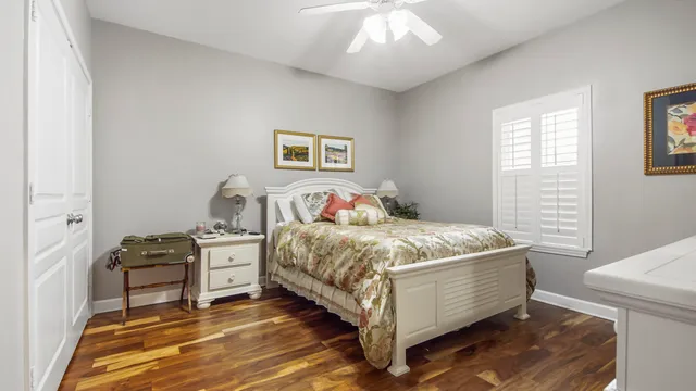 a bedroom with a bed and a table in it