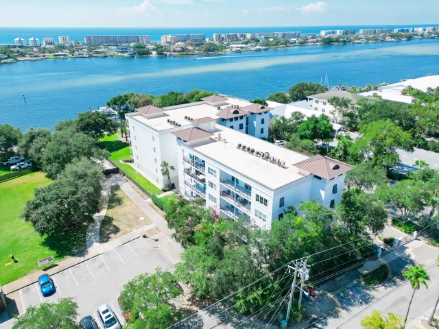 an aerial view of a house with lake view