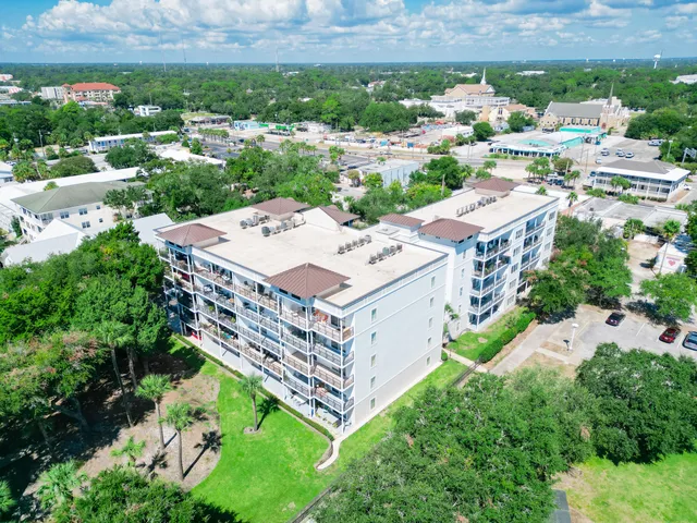 an aerial view of a house with a garden