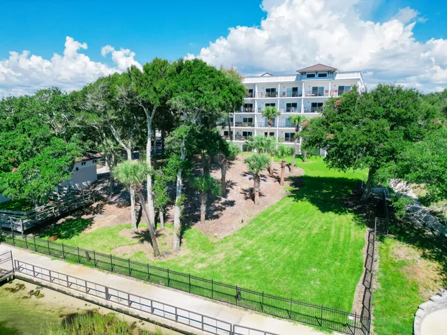 a view of a garden with a building