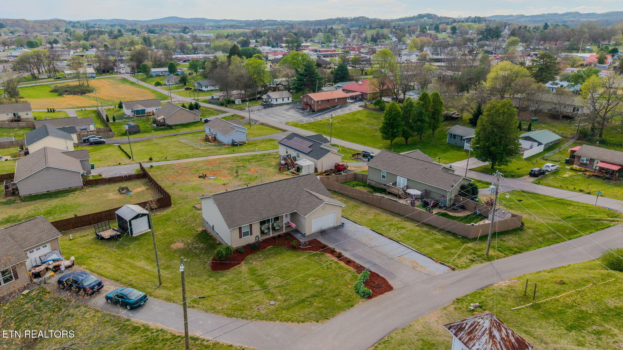 3215 Smith Road White Pine, TN 37890 - Photo 26 of 28 an aerial view of a house with a swimming pool yard and mountain view in back