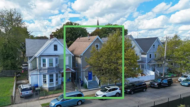 a view of multiple houses with a street
