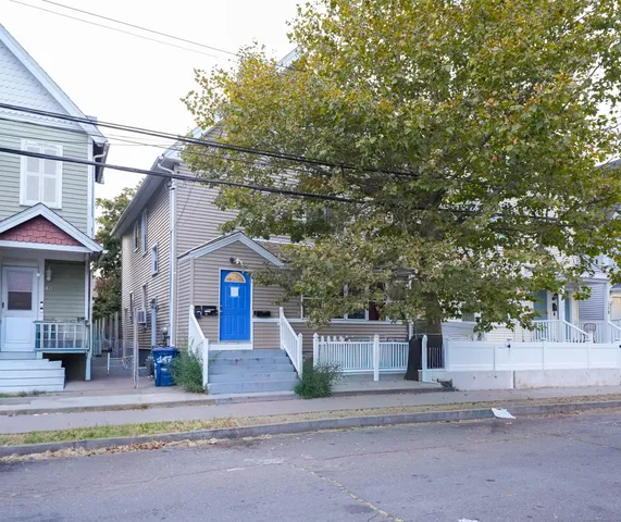 front view of a house with a street