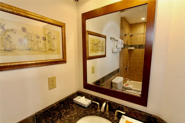 a bathroom with a tub and shower