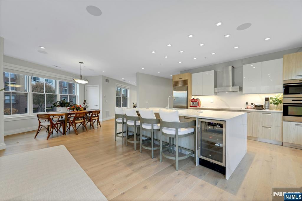 22 Ave At Port Imperial, Unit 114 West New York, NJ 07093 - Photo 14 of 39 a kitchen with lots of counter top space and dining table