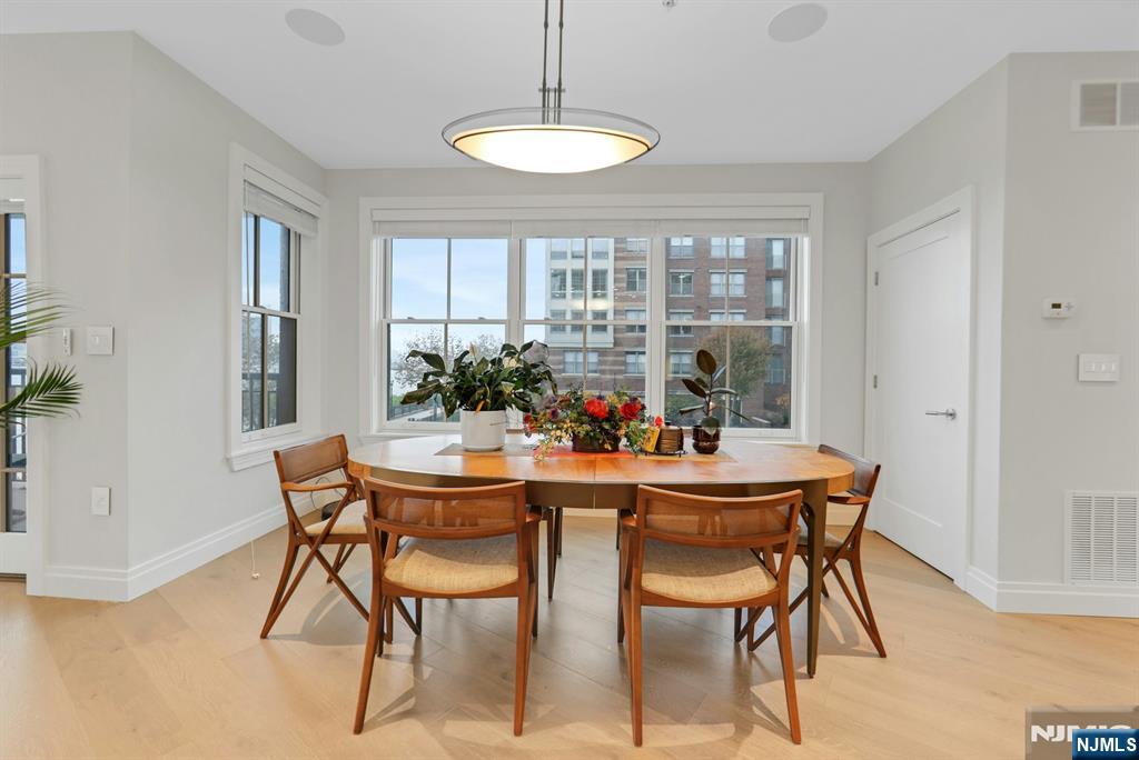 22 Ave At Port Imperial, Unit 114 West New York, NJ 07093 - Photo 15 of 39 a view of a dining room with furniture window and outside view