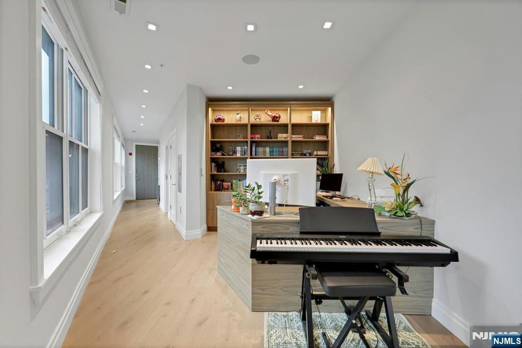 22 Ave At Port Imperial, Unit 114 West New York, NJ 07093 - Photo 17 of 39 a living room with furniture and a potted plant
