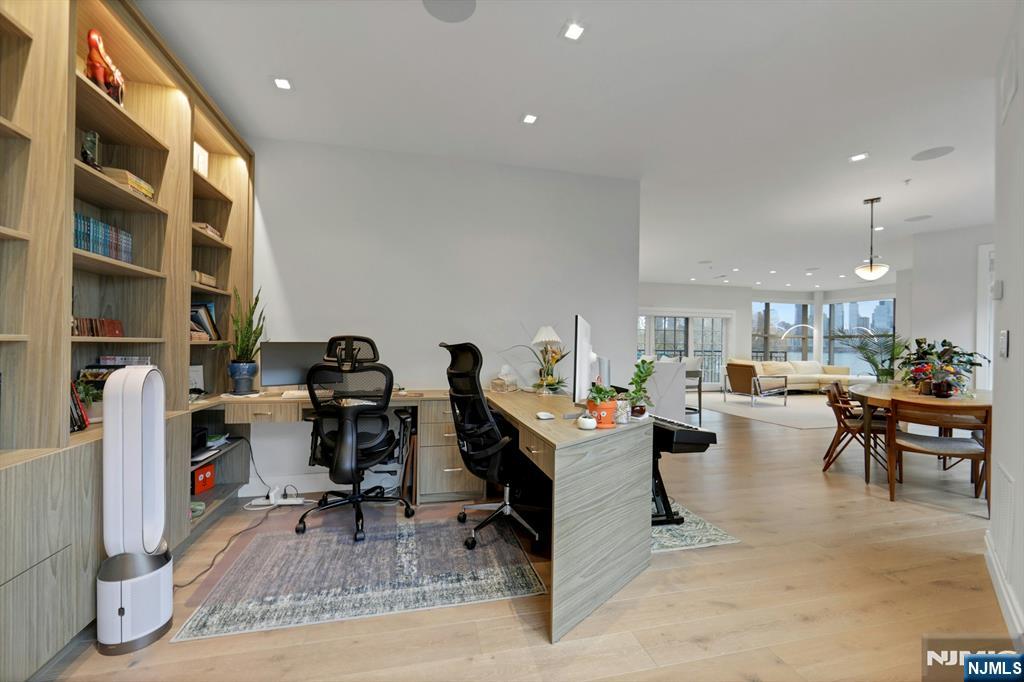 22 Ave At Port Imperial, Unit 114 West New York, NJ 07093 - Photo 18 of 39 a view of a workspace with furniture and a livingroom