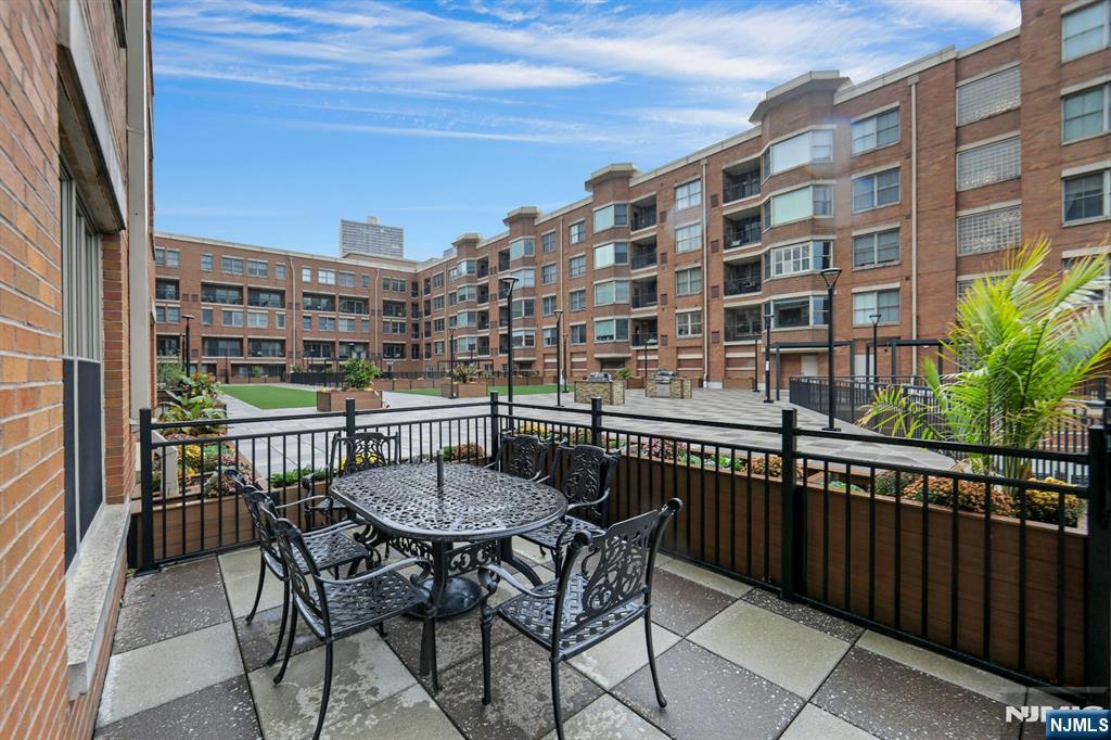 22 Ave At Port Imperial, Unit 114 West New York, NJ 07093 - Photo 28 of 39 a view of a chairs and table in the balcony