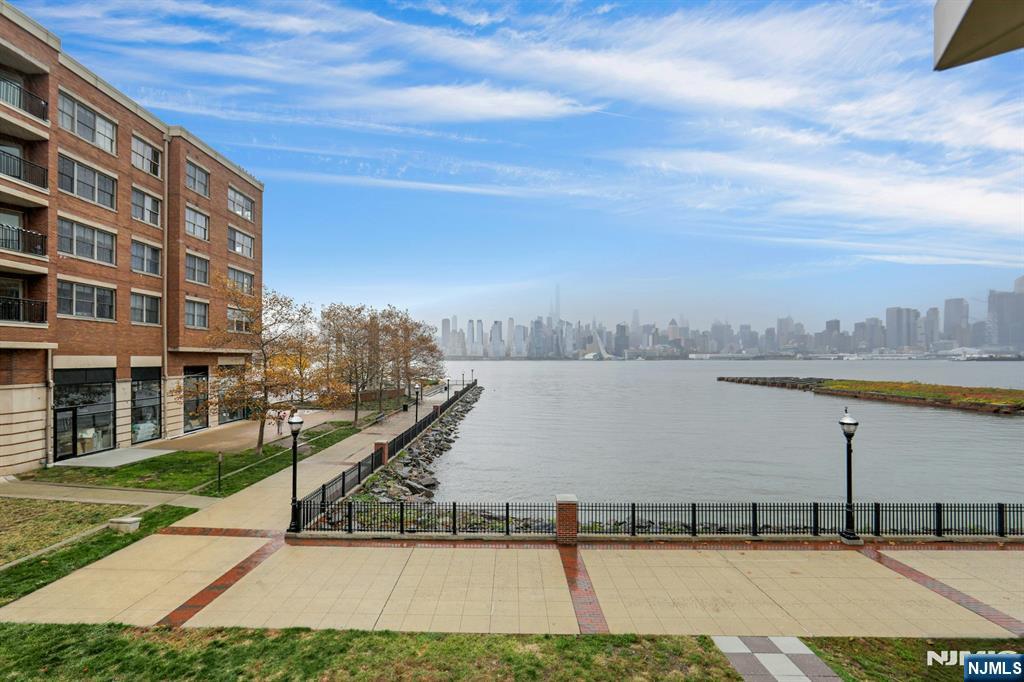 22 Ave At Port Imperial, Unit 114 West New York, NJ 07093 - Photo 30 of 39 a view of a swimming pool and a yard