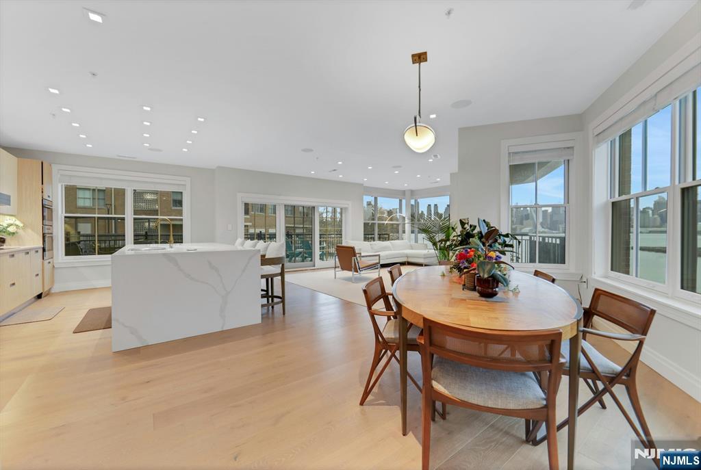 22 Ave At Port Imperial, Unit 114 West New York, NJ 07093 - Photo 3 of 39 a view of a dining room with furniture window and outside view