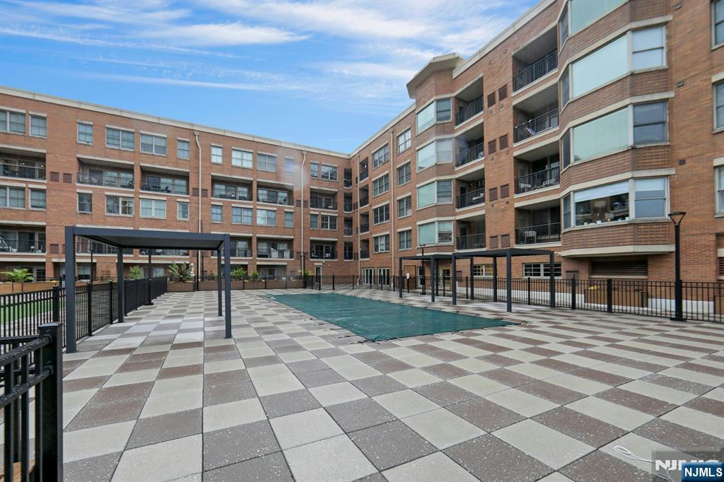 22 Ave At Port Imperial, Unit 114 West New York, NJ 07093 - Photo 33 of 39 a building view with outdoor space