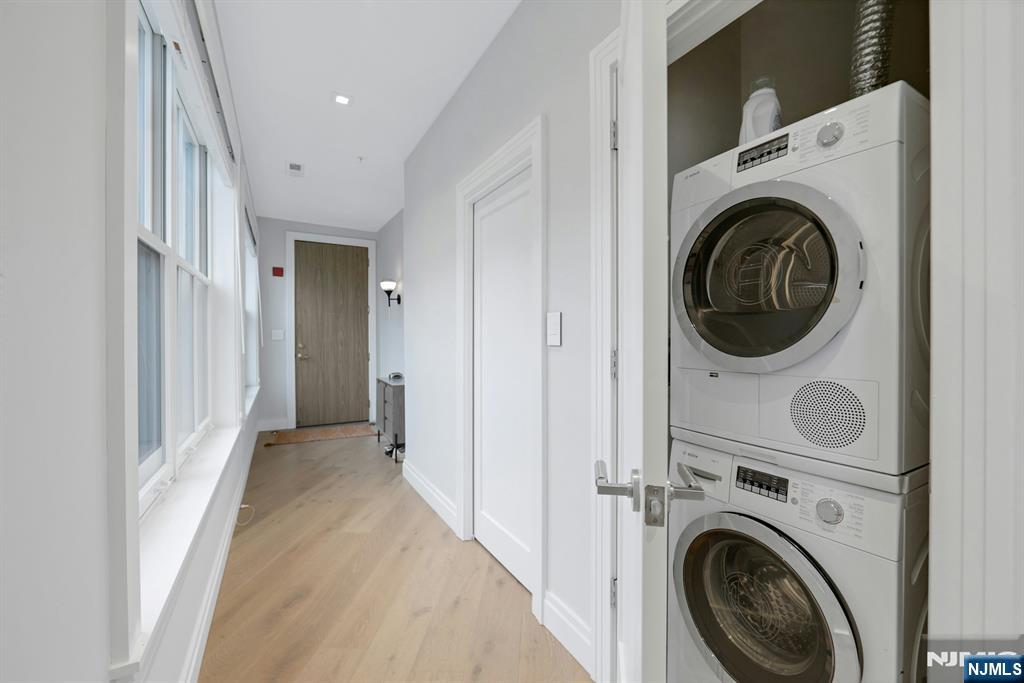 22 Ave At Port Imperial, Unit 114 West New York, NJ 07093 - Photo 7 of 39 a view of a hallway with washer and dryer