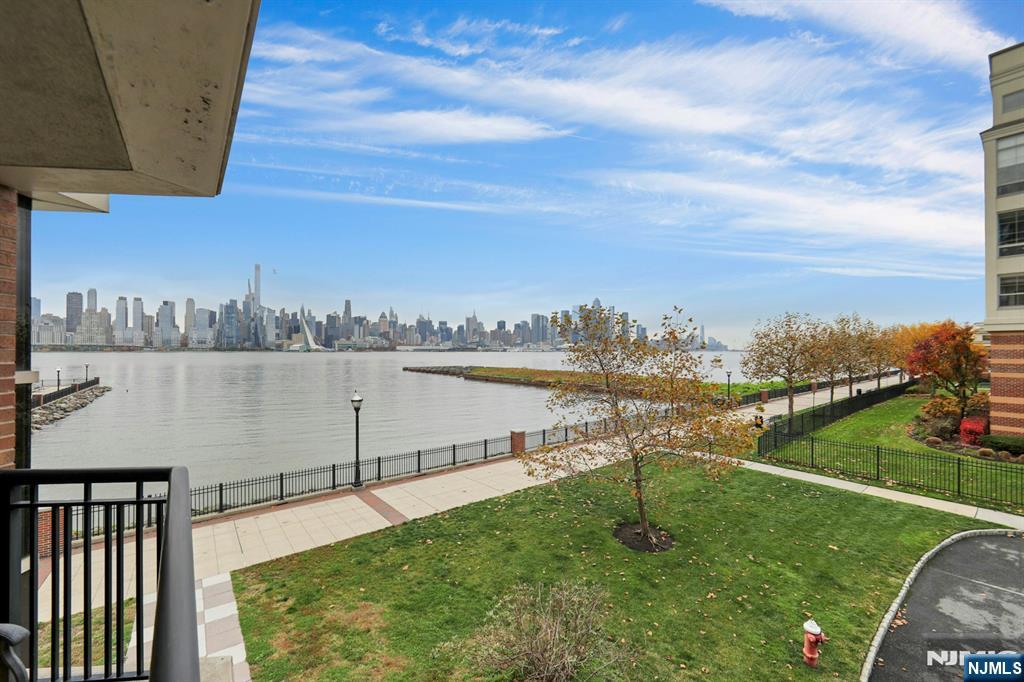 22 Ave At Port Imperial, Unit 114 West New York, NJ 07093 - Photo 10 of 39 a view of a lake with houses in back