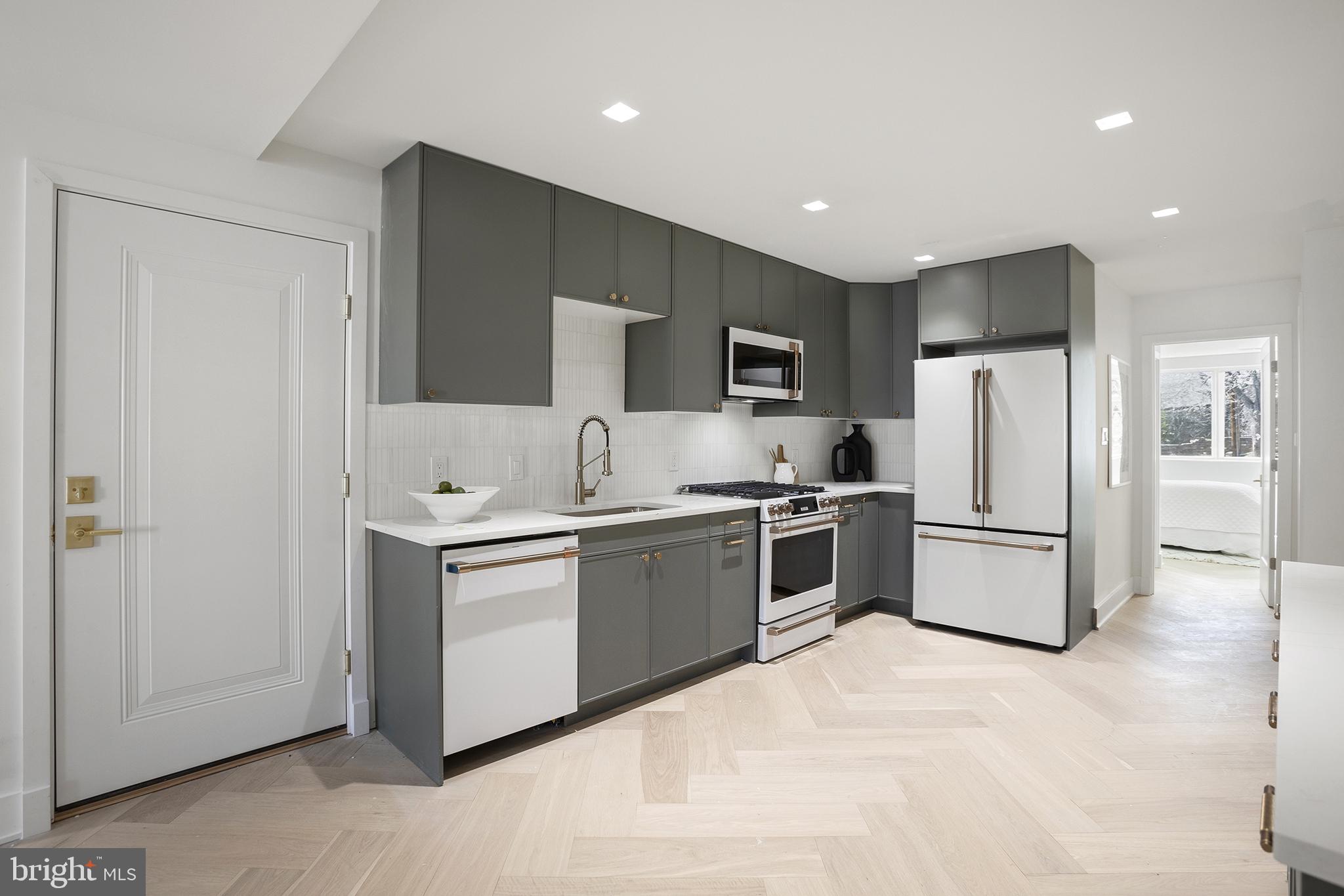 1212 4th Street Northwest, Unit 7 Washington, DC 20001 - Photo 11 of 39 Sleek modern kitchen with elegant finishes.