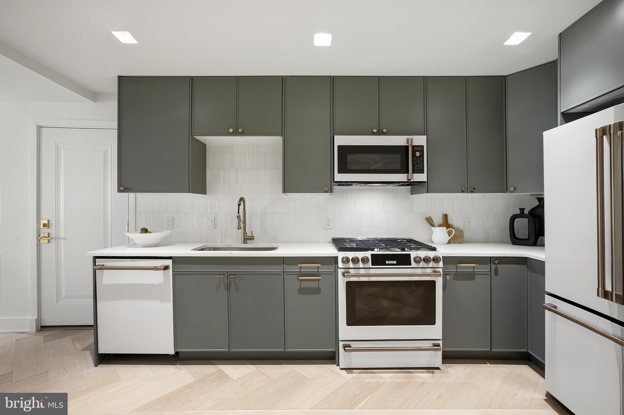 1212 4th Street Northwest, Unit 7 Washington, DC 20001 - Photo 15 of 39 Sleek modern kitchen with stylish finishes.