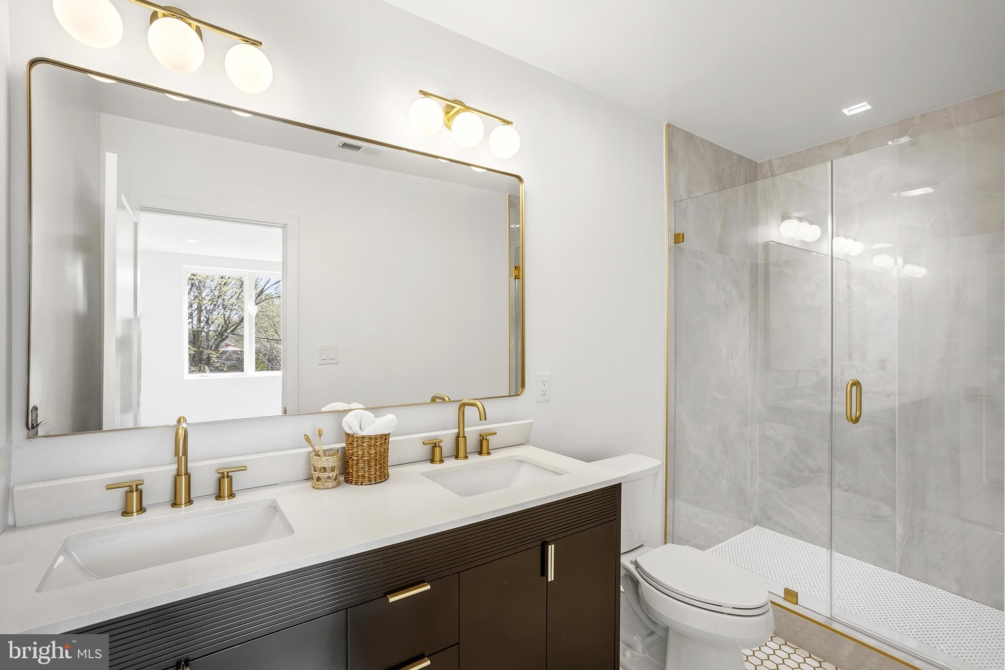 1212 4th Street Northwest, Unit 7 Washington, DC 20001 - Photo 28 of 39 Elegant dual-sink bathroom retreat.