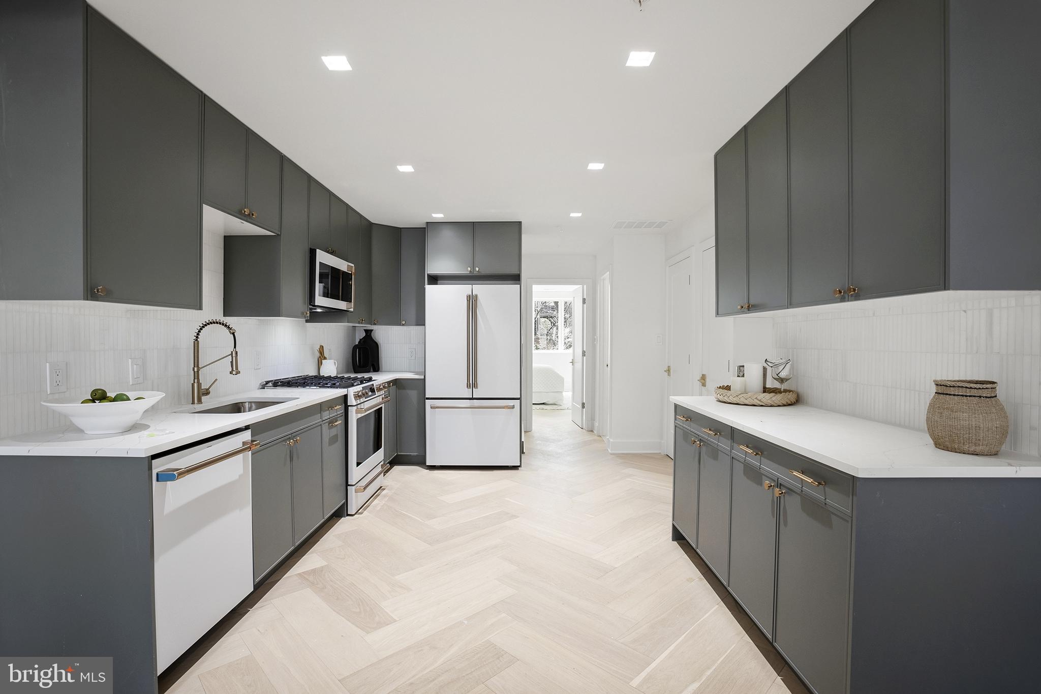 1212 4th Street Northwest, Unit 7 Washington, DC 20001 - Photo 10 of 39 Sleek modern kitchen with elegant finishes.