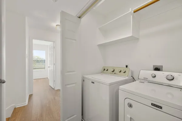 a view of storage and utility room with washer and dryer