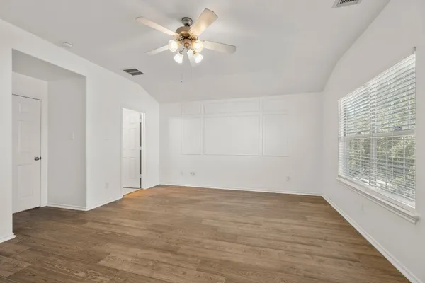 a view of an empty room with a window