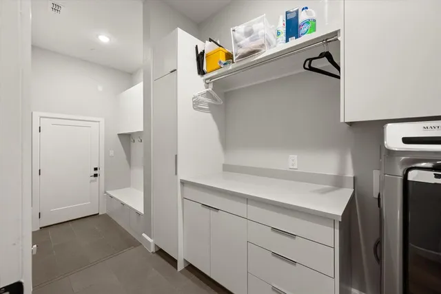 a view of hallway with washer and dryer