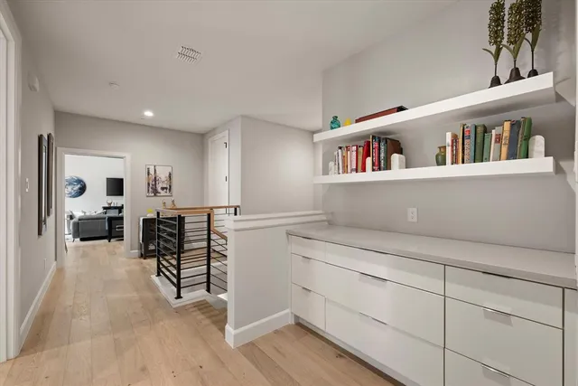 a view of living room with furniture and wooden floor