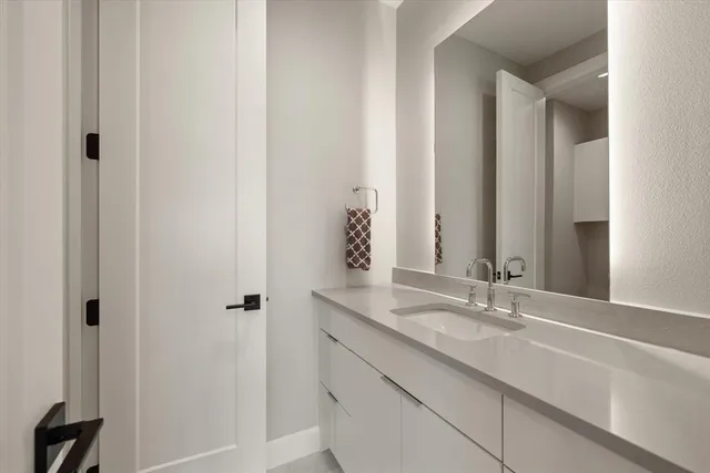 a bedroom with 2 bed and a window