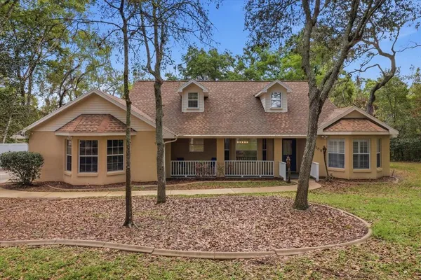 front view of a house with a yard