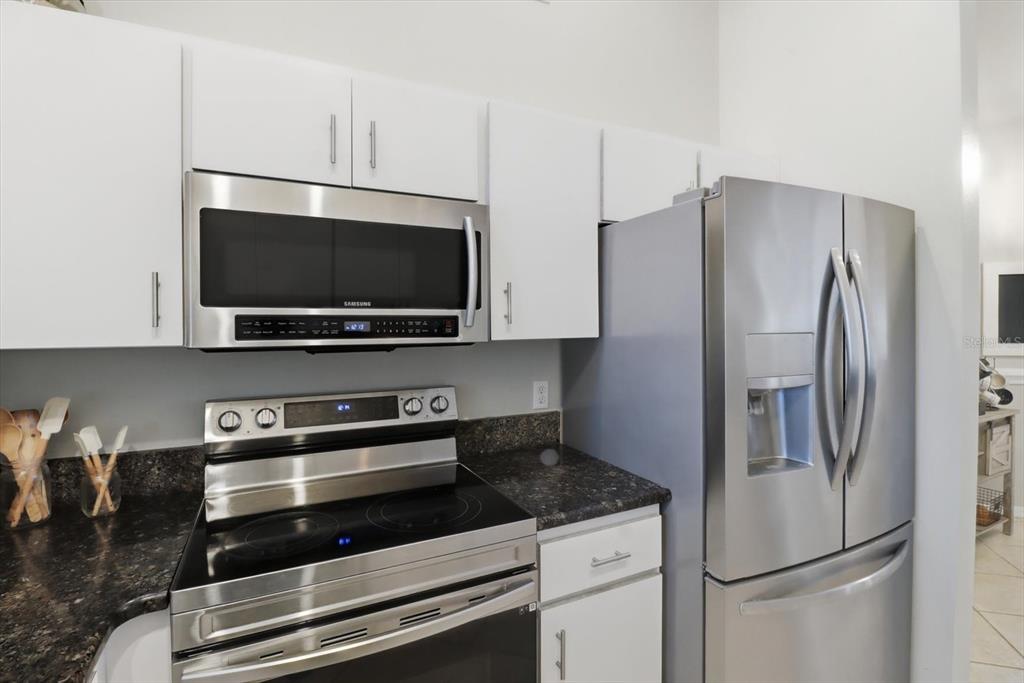 3189 South Graymor Path Inverness, FL 34450 - Photo 12 of 46 a kitchen with stainless steel appliances a refrigerator a stove and a microwave