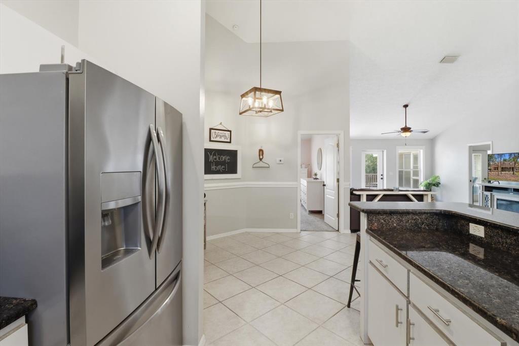 3189 South Graymor Path Inverness, FL 34450 - Photo 14 of 46 a kitchen with stainless steel appliances granite countertop a refrigerator a oven and white cabinets