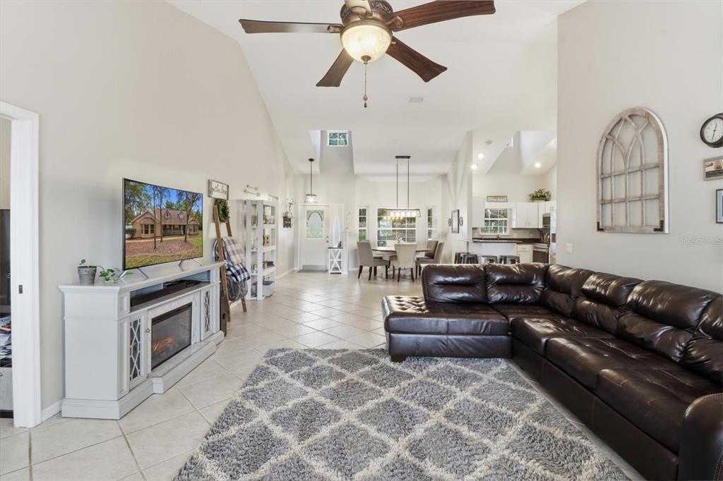 3189 South Graymor Path Inverness, FL 34450 - Photo 20 of 46 a living room with furniture and a fireplace
