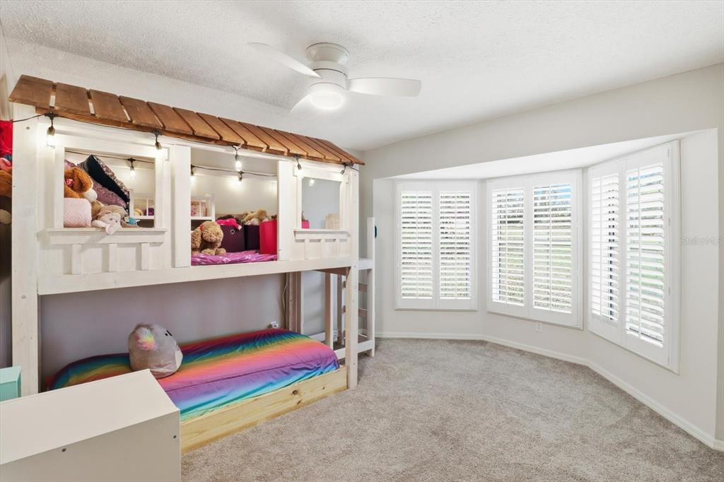 3189 South Graymor Path Inverness, FL 34450 - Photo 22 of 46 a bedroom with furniture and a large window